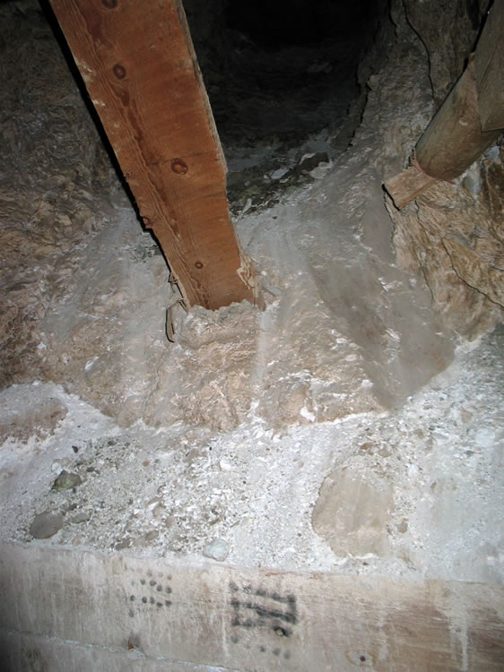 Some interesting circular marks at the base of an inclined rise leading up off the main tunnel.