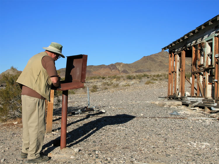 Mohave signs the log book up at the spring.