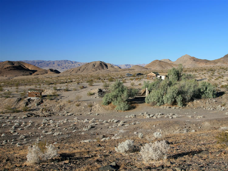 A look back at some of the more recent structures south of the spring.  The photo is taken from the hill to the east.