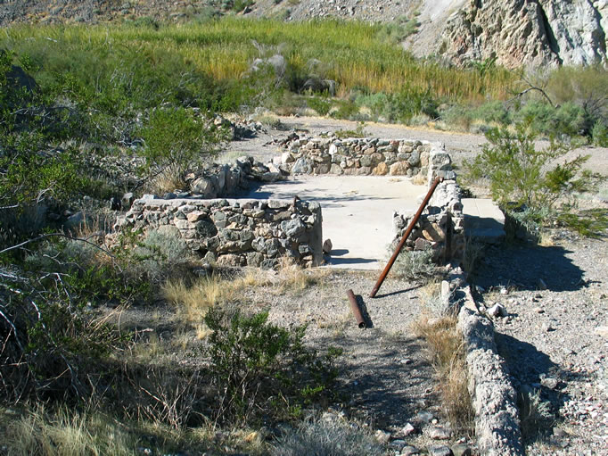 Before their arrival, the cabin site was rumored to have been the location of a still.  Notice the vegetation around the spring beyond the cabin ruins.