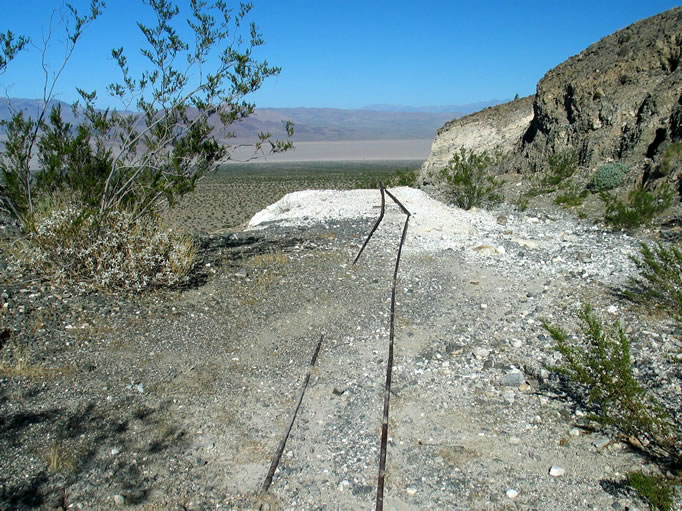 The rails running out from the tunnel entrance.