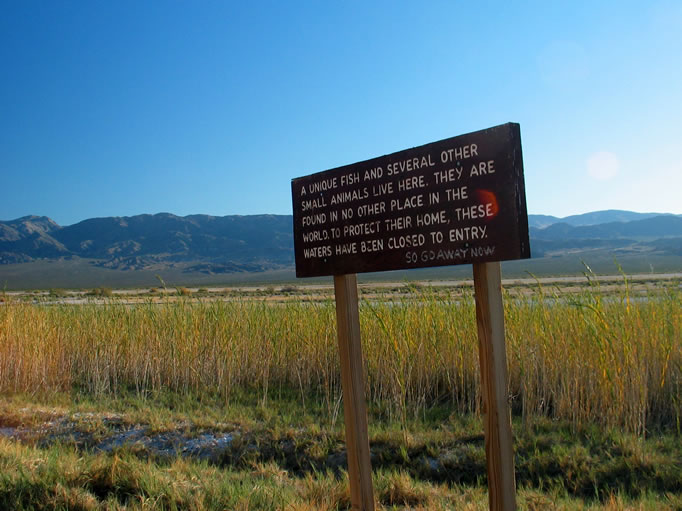 Informational sign, with crusty comment, at the parking area.