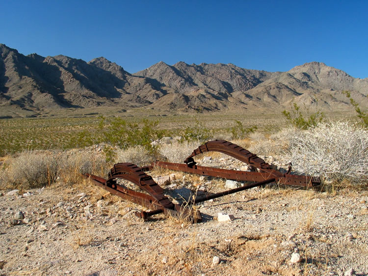 Some heavy duty springs on an old trailer frame with the mountains again forming a scenic backdrop.