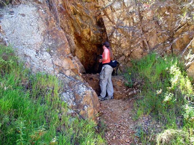 Niki looks into a small prospect as we approach the Renton Mine area.