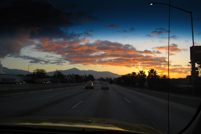 It's a cool February morning as we head east into a colorful sunrise on our way to Joshua Tree National Park.