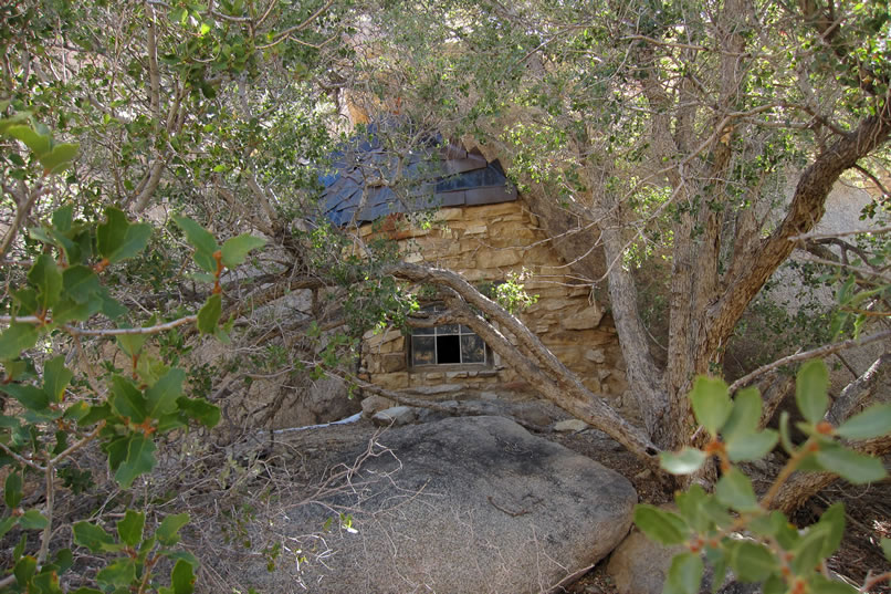 Back outside again, we pass by the stacked stone wall and window on our way up to the little hollowed out boulder that might once have served as a habitation or work site.