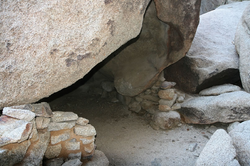 Here's a look at the hollowed out boulder and its remaining stacked rock walls.