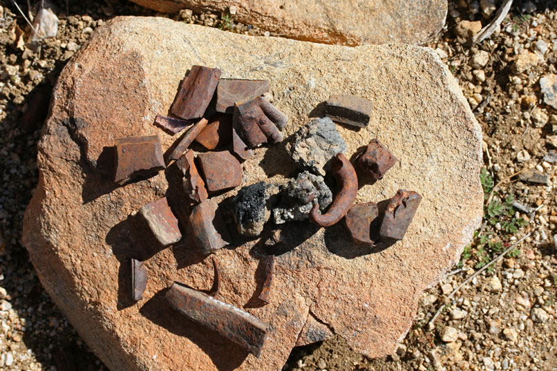 Lumps of slag and bits of broken drill steel bits attest to the work done at this site.