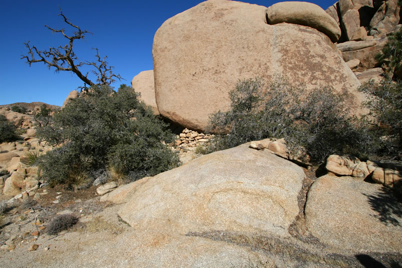 Not too far off the trail, we spy some stacked stones that we missed on the way out his morning.