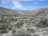 As clouds build in the afternoon, we again enter the mouth of Pinyon Canyon for our return trip. (135kb)