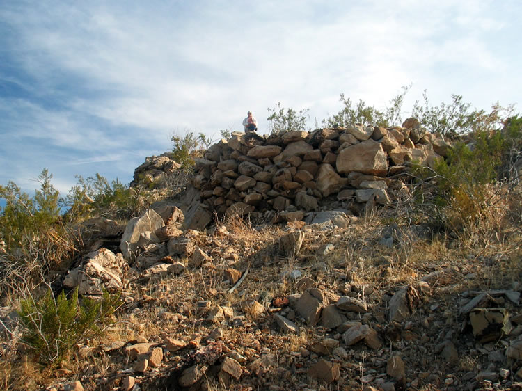 Looking up at the rock foundation for one of the numerous level pads that dot the site.