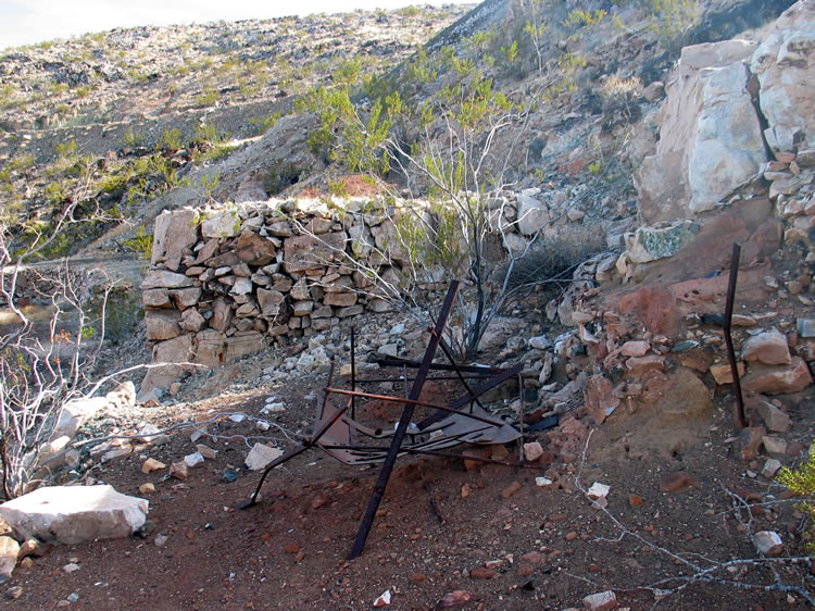 Again, we're not sure what the iron remnant is from.  It does appear that a furnace might have been located here.  Downhill from this spot numerous artifacts from the assaying process are found.