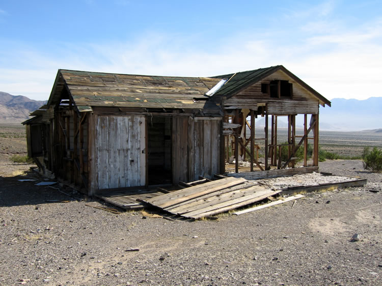 The scattered wooden structures date to the talc mining phase that began around 1930 and lasted as late as the 1960's.