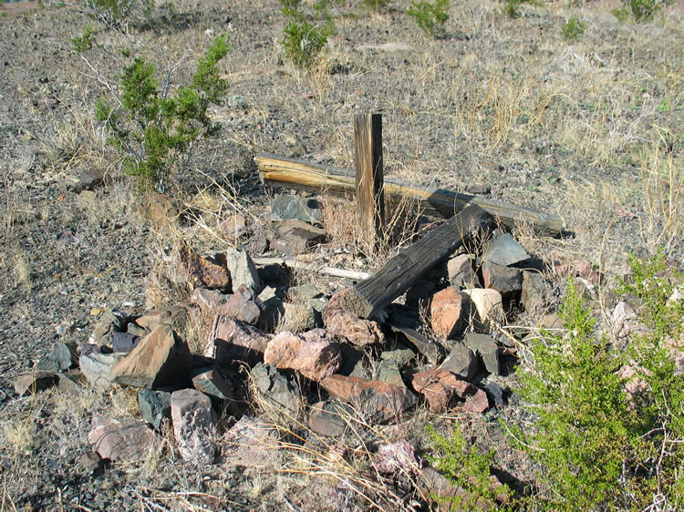 Unmarked grave near the old stone cabin.