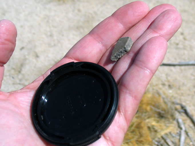 Some pottery fragments were found, photographed, and replaced.