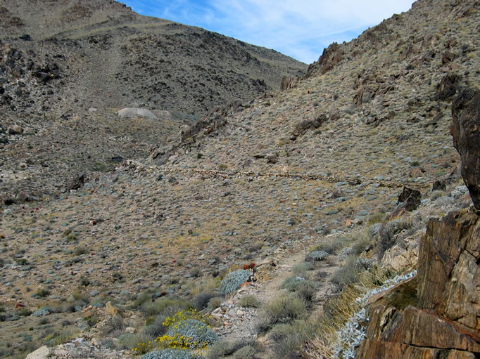 As we round a corner, we can see ahead of us the tailings pile at the Contact Mine.