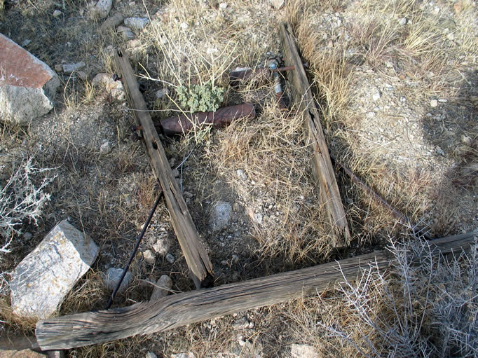 This wood framework and roller assembly probably made possible the transfer of power from the gas engine to the arrastra via a drive pulley.