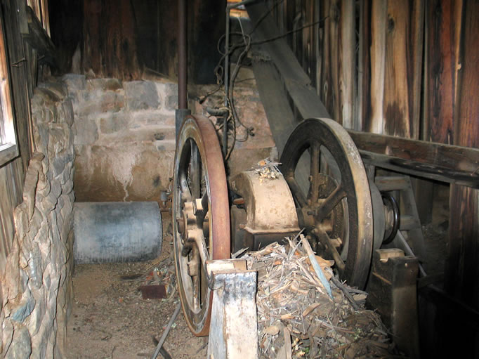 This is the twelve horse power single cylinder Western gas engine, built in 1906, that powers all the mill equipment.  It operated until 1960 with the original make-and-break ignition system, but was converted at that time to the more modern spark plug.