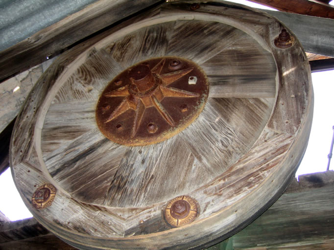 A very elegant wood and iron bull wheel.