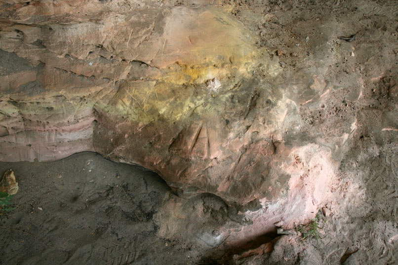 Here's a closer view in which you can see many of the straight line incisions worn into the rock.