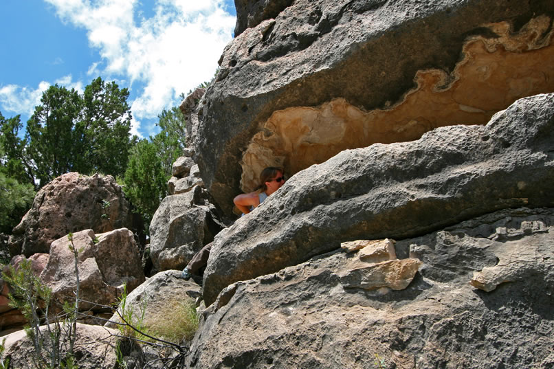 It isn't easy to access the crevice.  In addition, Niki has to assess whether she can safely negotiate the ledge without coming in contact with the delicate pictos.