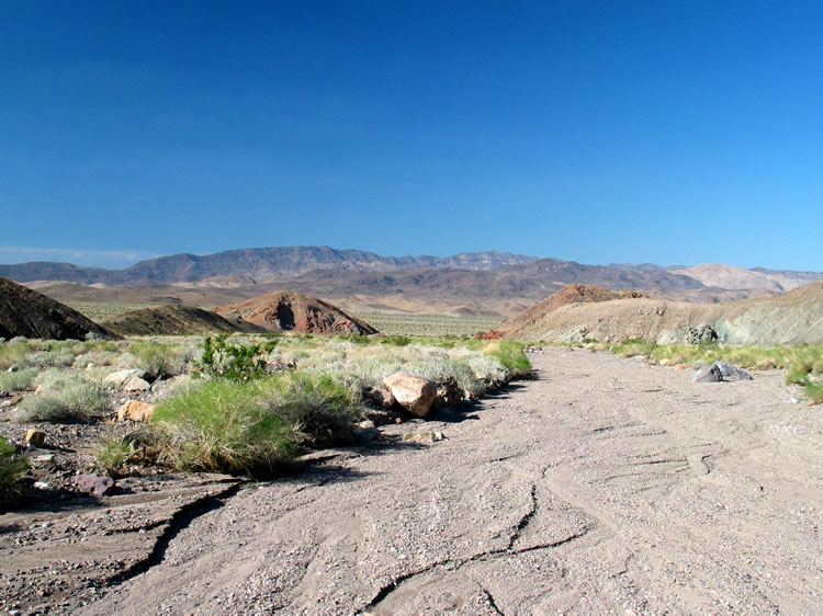 We continue to drop down this colorful canyon until finally we see the basin containing Owl Lake.