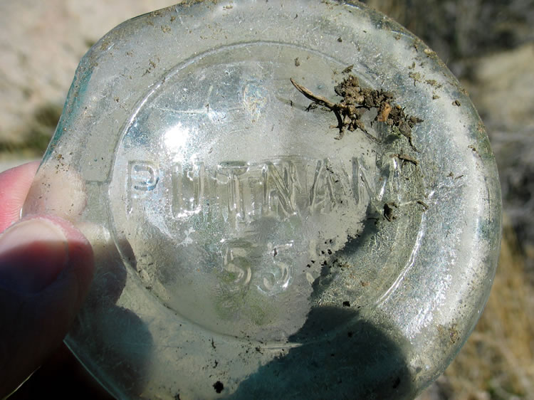A glass jar fragment.