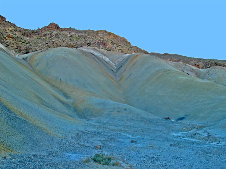 The shadows are growing as we pass by this delicately patterned mud hill on the way back to the quarry and the truck.
