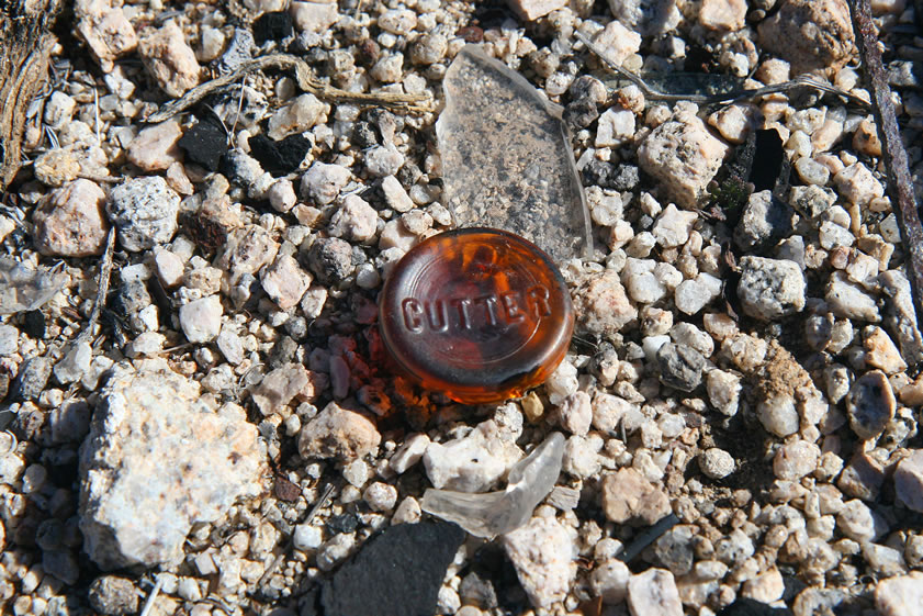 The embossed base of a bottle.