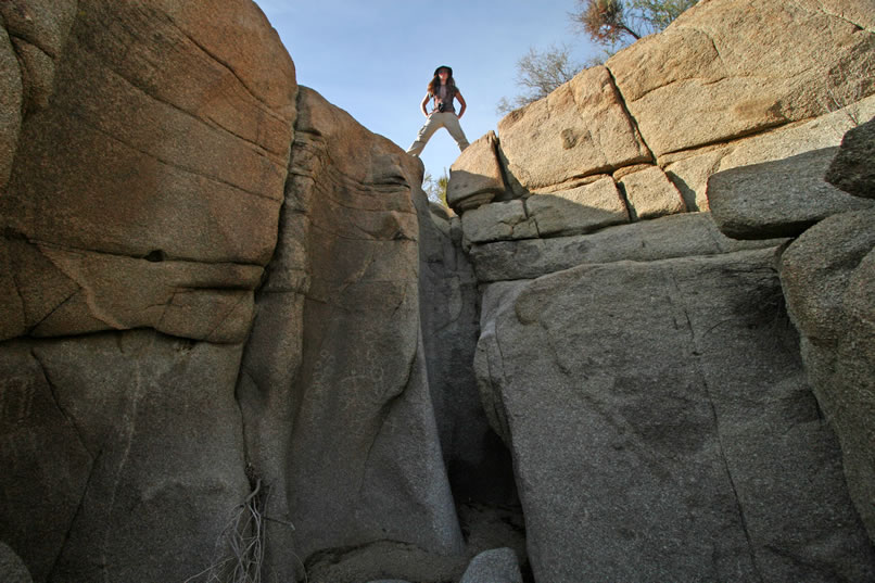 This narrow chasm that Niki stands astride is quite remote and near a very scenic massive jumble of boulders.  We're sure that those ancient petroglyph makers were just as impressed with the powerful awe and majesty of this site as we are.