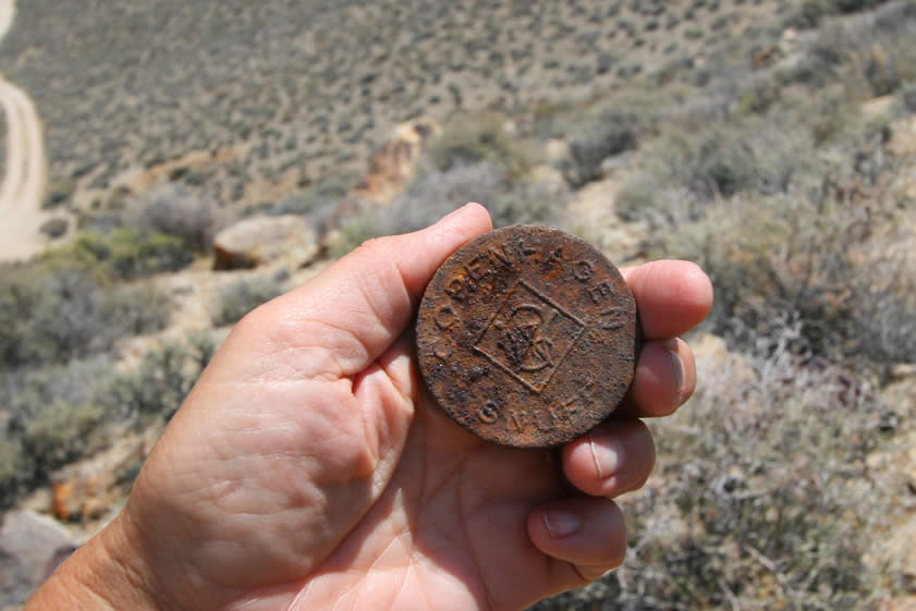 Although the cardboard containers for the snuff have long since rotted away, the tin lids with the embossed Copenhagen Snuff logo are still around.