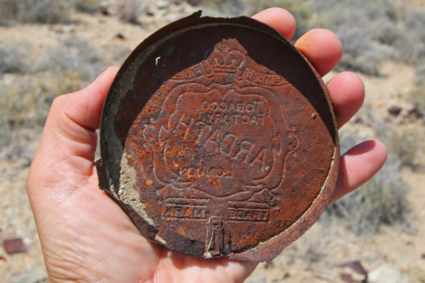 The back side reveals that the lid is from an Ardath Tobacco Factory tin.