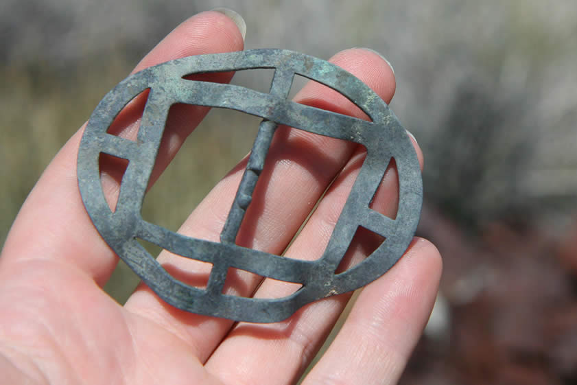 A belt buckle also catches our eye.