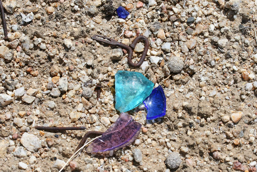 Much of the glass that we find is quite colorful.  This is due to the fact that manganese oxide, which was used to clarify glass bottles, turns various shades of purple when exposed to desert sun for long periods of time.
