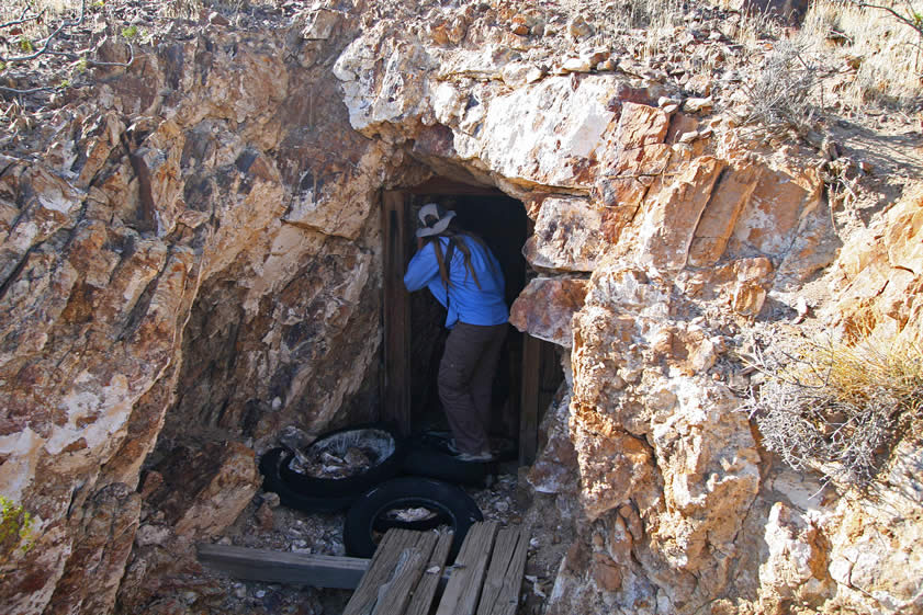 Niki at the adit entrance after having literally "walked the plank" over an open pit to get there.