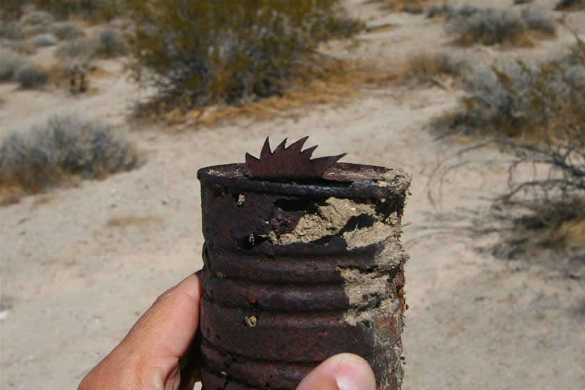 Nearby is a can that has been opened in a very distinctive fashion.