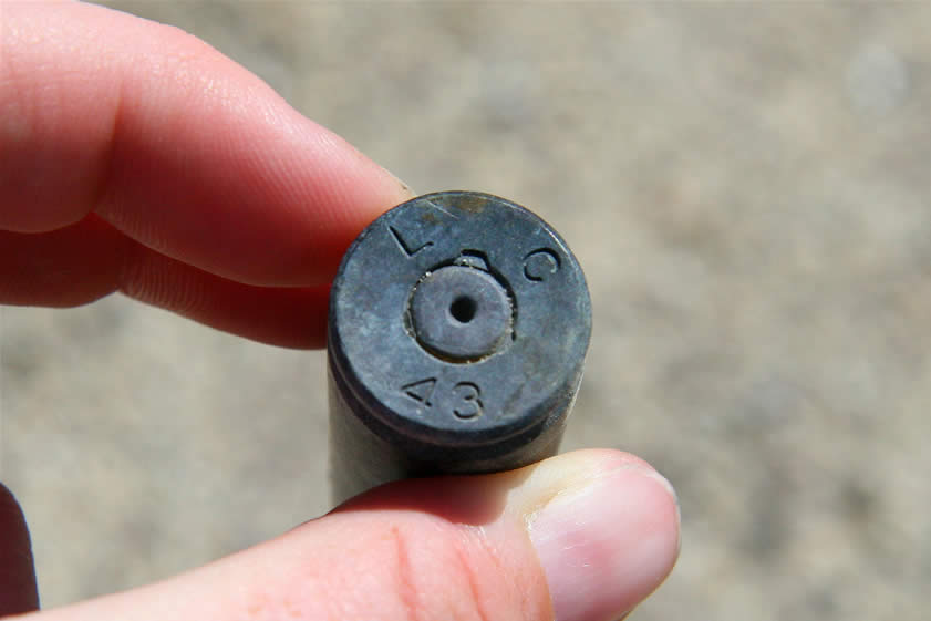 Returning once again to the truck we're just about ready to leave when we spot an old .50 caliber machine gun shell.  This is a remnant from the time during WW II when this area was used as a bombing and strafing range.  The head stamp on this shell indicates that it was manufactured in 1943 at the Lake City Army Munitions Plant, Independence, Missouri.