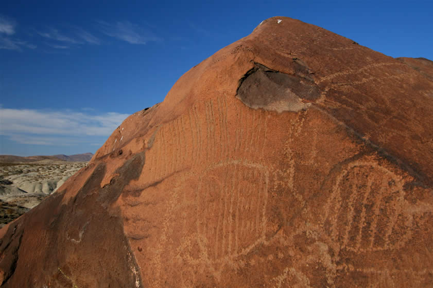 This even closer shot shows the deeply incised vertical lines.  There's a great deal of superimposition on this boulder where newer glyphs are placed over older ones.