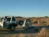 Setting up camp on Mesquite Dry Lake and looking through the scope. (53kb)