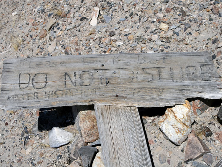 We notice this fallen sign as we make our way back to the truck.  We've enjoyed our trip here to a land of slow time and long memories.  Little seems to have changed and the gulf between the past and present gets a bit blurred.  We like that.  Thanks for joining us!