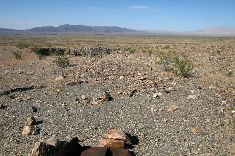 We find the faint outline of a third tent cabin site down near the scattered parts of the old auto.