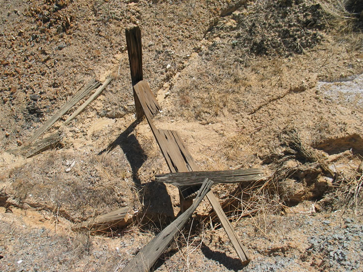 This crude outhouse that we found near the stone foundation is only one step above crouching behind a bush!