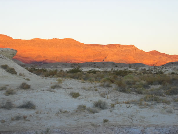 Hills awash in the glow of the setting sun.