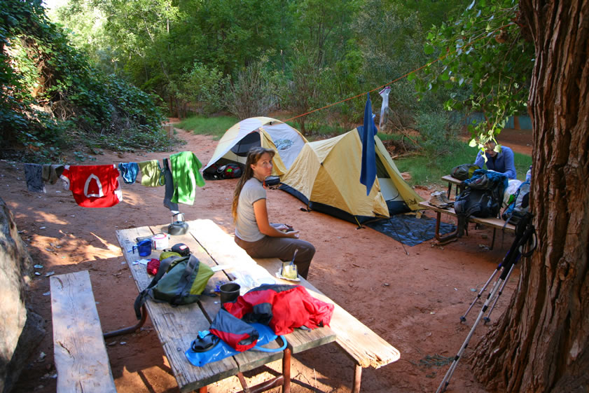 It's a dazed and aching crew that straggles out of their sleeping bags this morning.  However, Jamie gets everyone's attention with a plan.  Let's move!  That's right, there's a primo spot right next to the creek so get those tents unstaked and let's haul 'em to our new home!