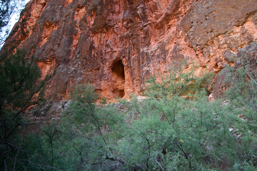 Approaching the old mine tunnel in the sheer face of the cliffs.
