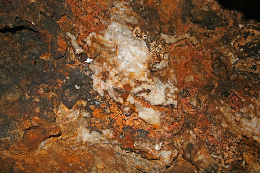 It isn't long before all daylight is left behind.  However, the beam of the flashlight reflects back the glint of numerous calcite crystals.