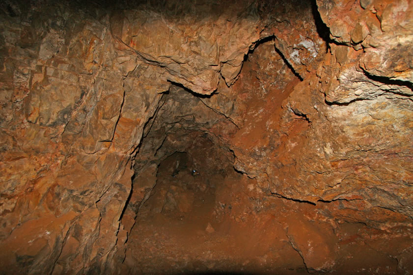 Moving still deeper into the side of the cliff.