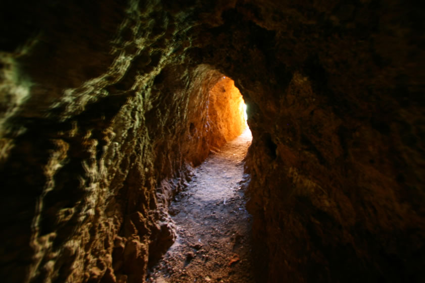 After passing through the twinkling reflections again, daylight and the tunnel opening appear.