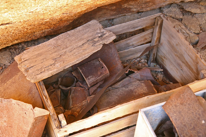  Nearby there's also an old wooden box filled with assorted hole and cap cans consistent with the late 1800's to early 1900's use of the site.