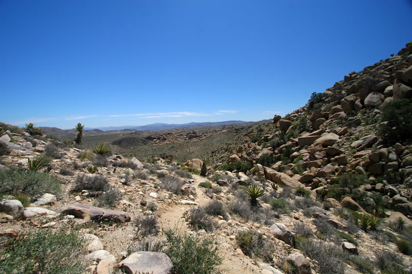 As the trail tips downward we get a nice panoramic view of the valley below.